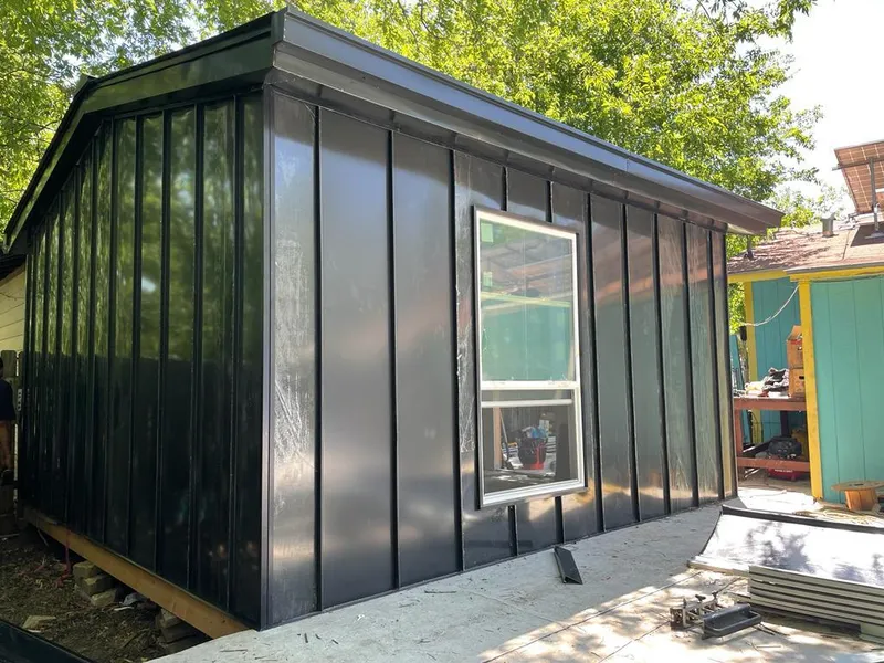 Black standing seam metal wall panels for Roof Inspection in Winter Gardens