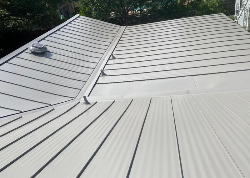 Solar attic fan installed on a metal roof for Roof Ventilation in Winter Gardens